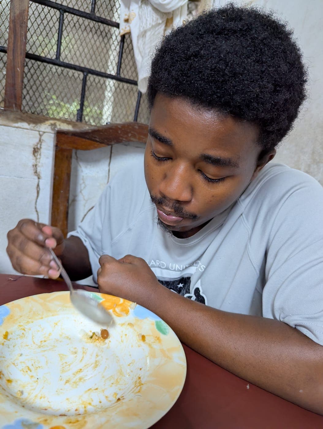 Emmanuel having a meal at home in the evening
