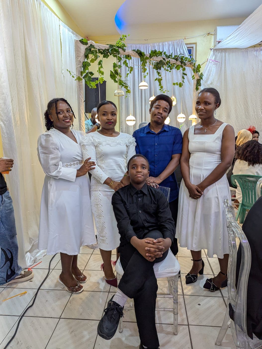 Emmanuel with friends at a celebration
