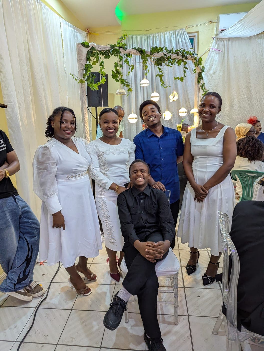 Emmanuel with a group dressed formally for an event