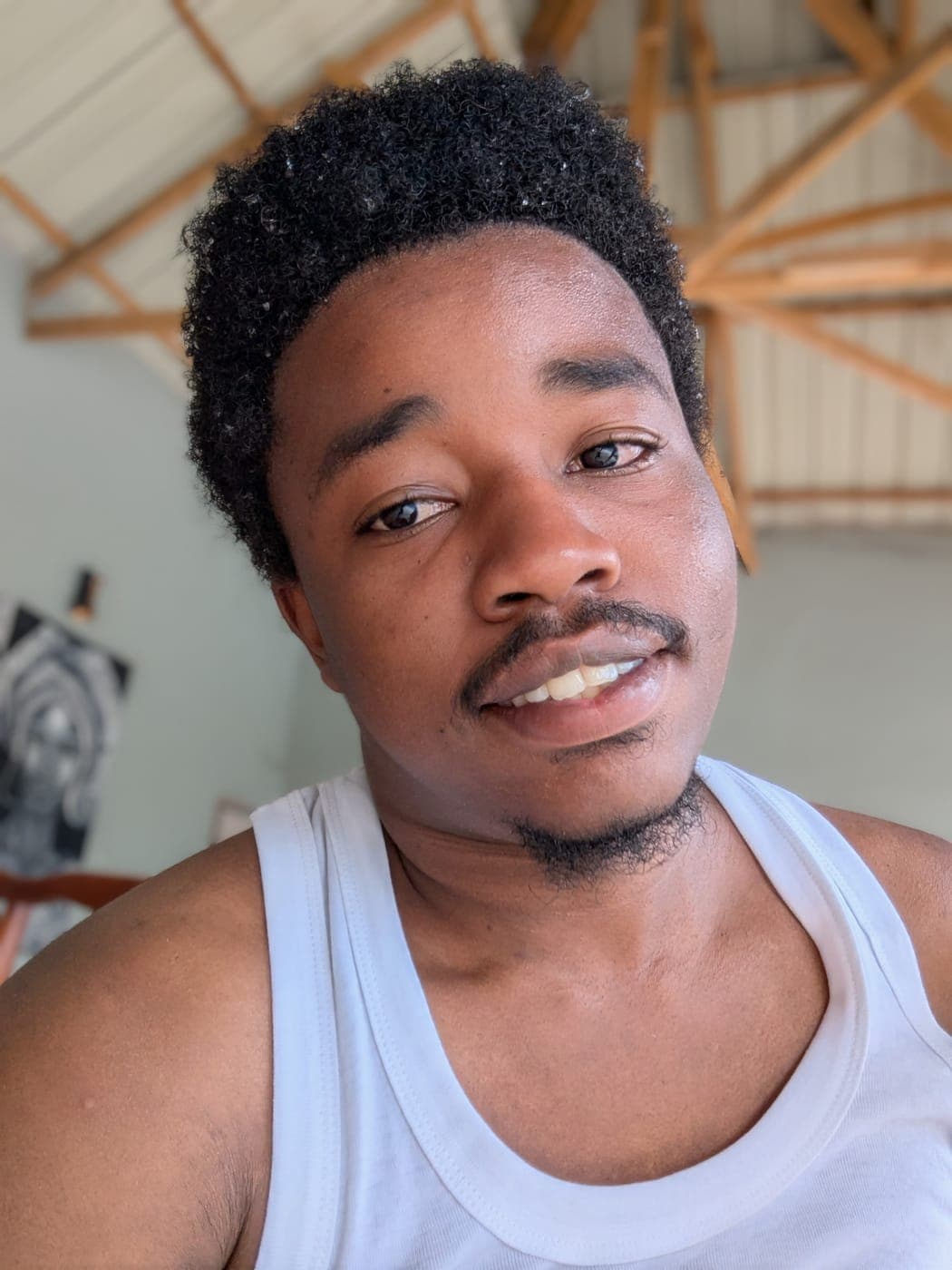 Emmanuel outdoors on a relaxed day off